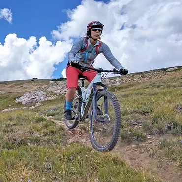 Eleanor riding in high alpine setting 