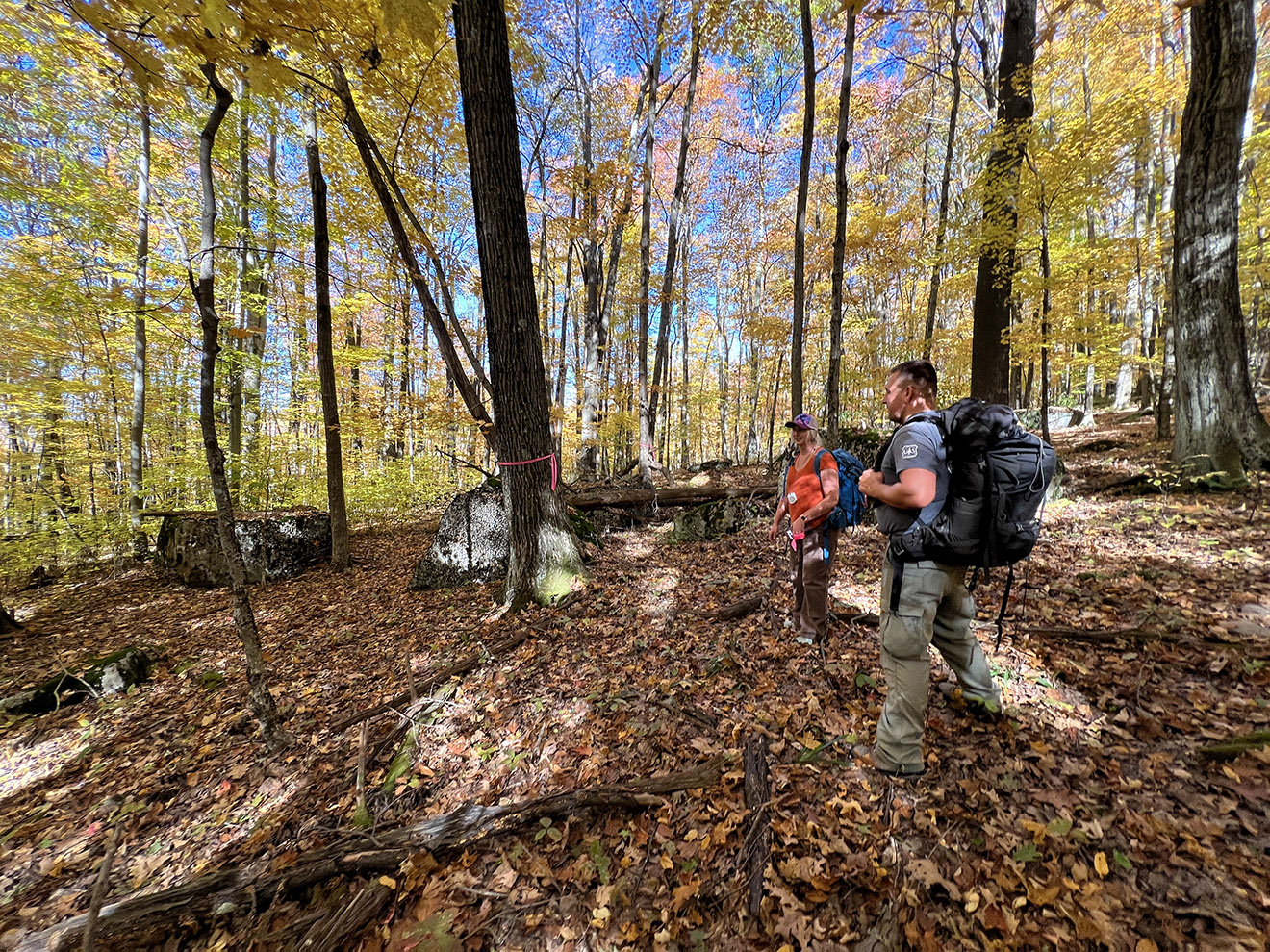 Liz Grades, IMBA Planner, and a U.S. Forest Service planner discuss planning in the forest.