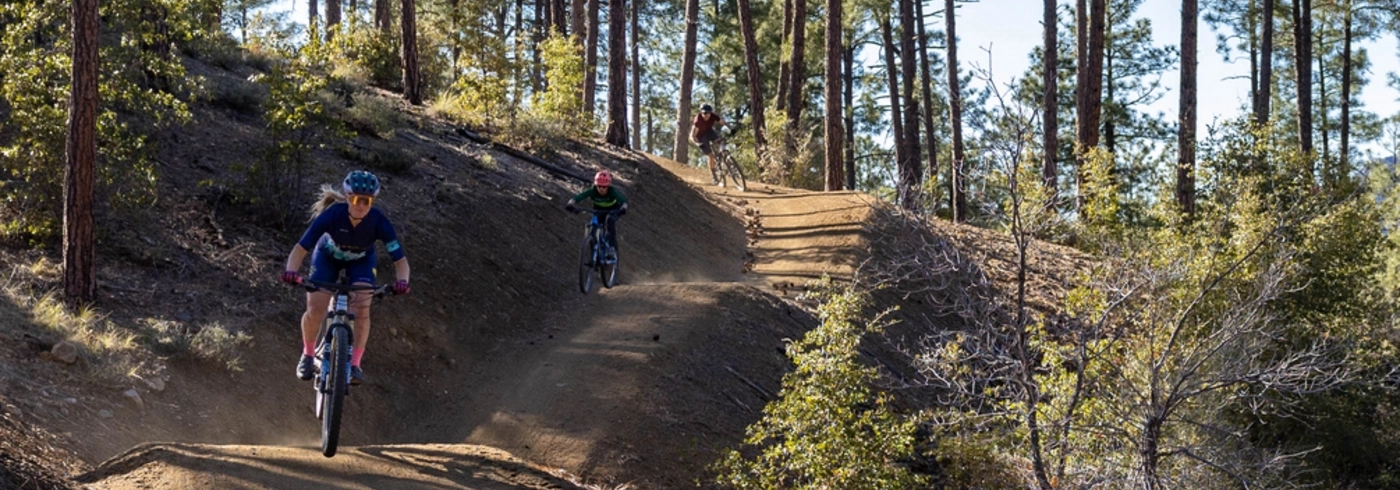 Mountain bikers riding in Bean Peaks Trail System