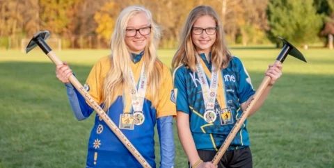 Student athletes with tools and medals