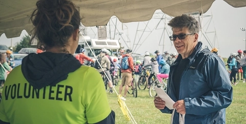 A volunteer with MORE talks with a participant at the MoCo EPIC event.