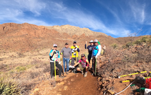 Participants of the BMBA trail care school pose for a group photo in the field